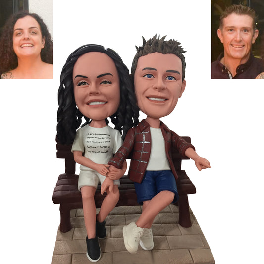 Customized Couple Bobbleheads Sitting on a Bench